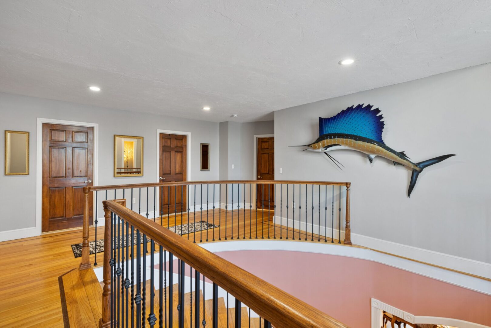 Wooden staircase with marlin wall decor