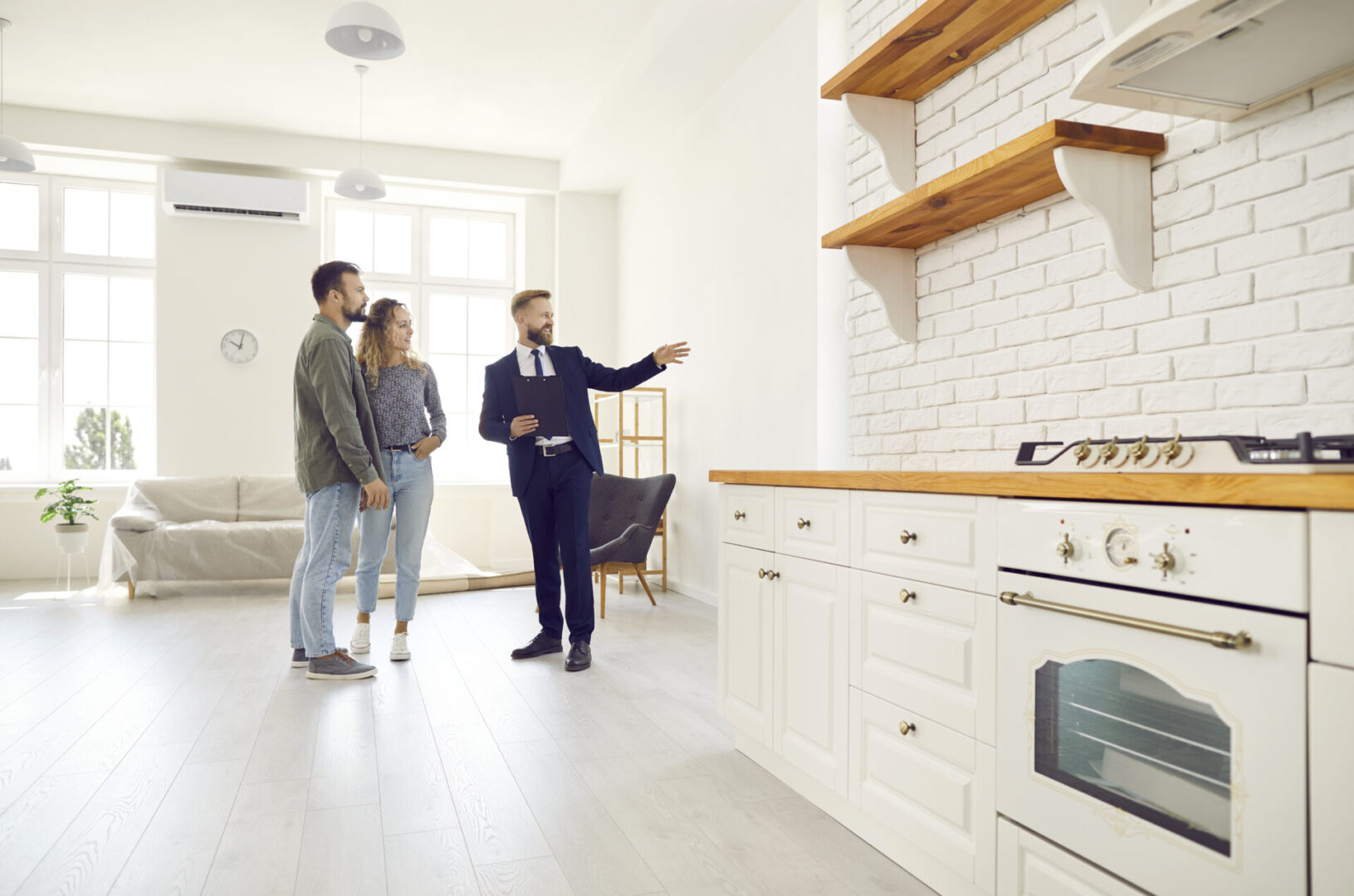 Real estate agent showing modern kitchen